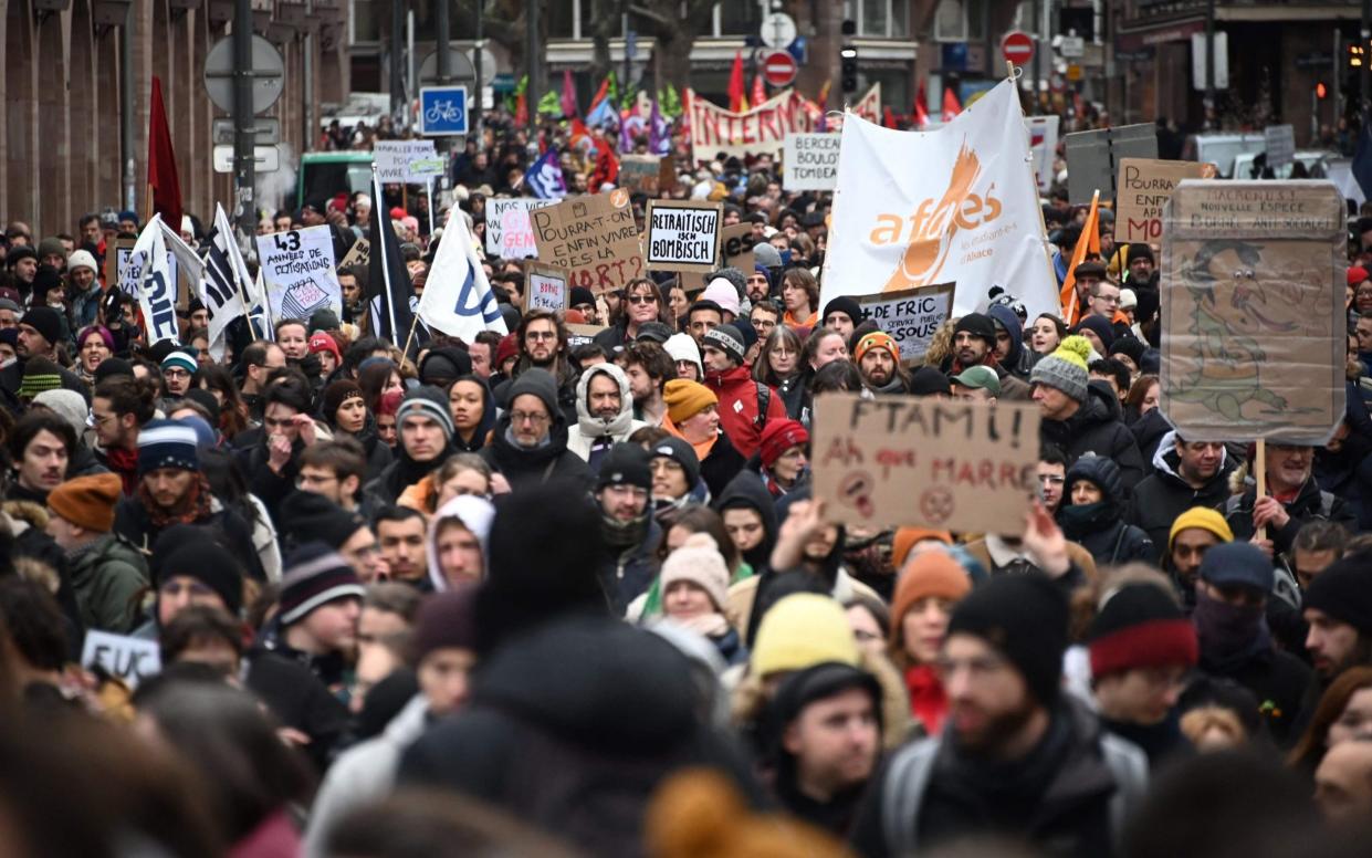 Thousands of people march during strike action on Tuesday in France - FREDERICK FLORIN/AFP