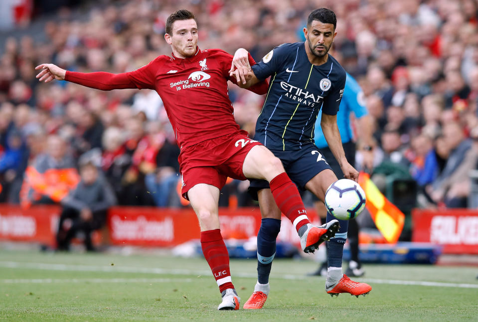Riyad Mahrez (right) battles with Liverpool’s Andrew Robertson