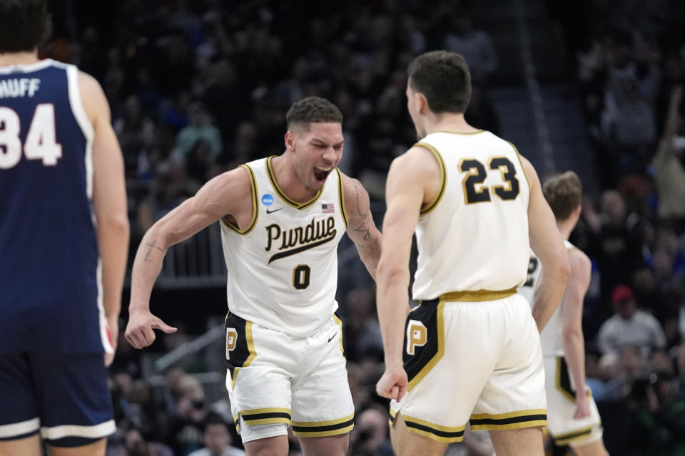 Purdue forward Mason Gillis (0) reacts with forward Camden Heide (23) after a play during the second half of a Sweet 16 college basketball game against Gonzaga in the NCAA Tournament, Friday, March 29, 2024, in Detroit. (AP Photo/Paul Sancya)