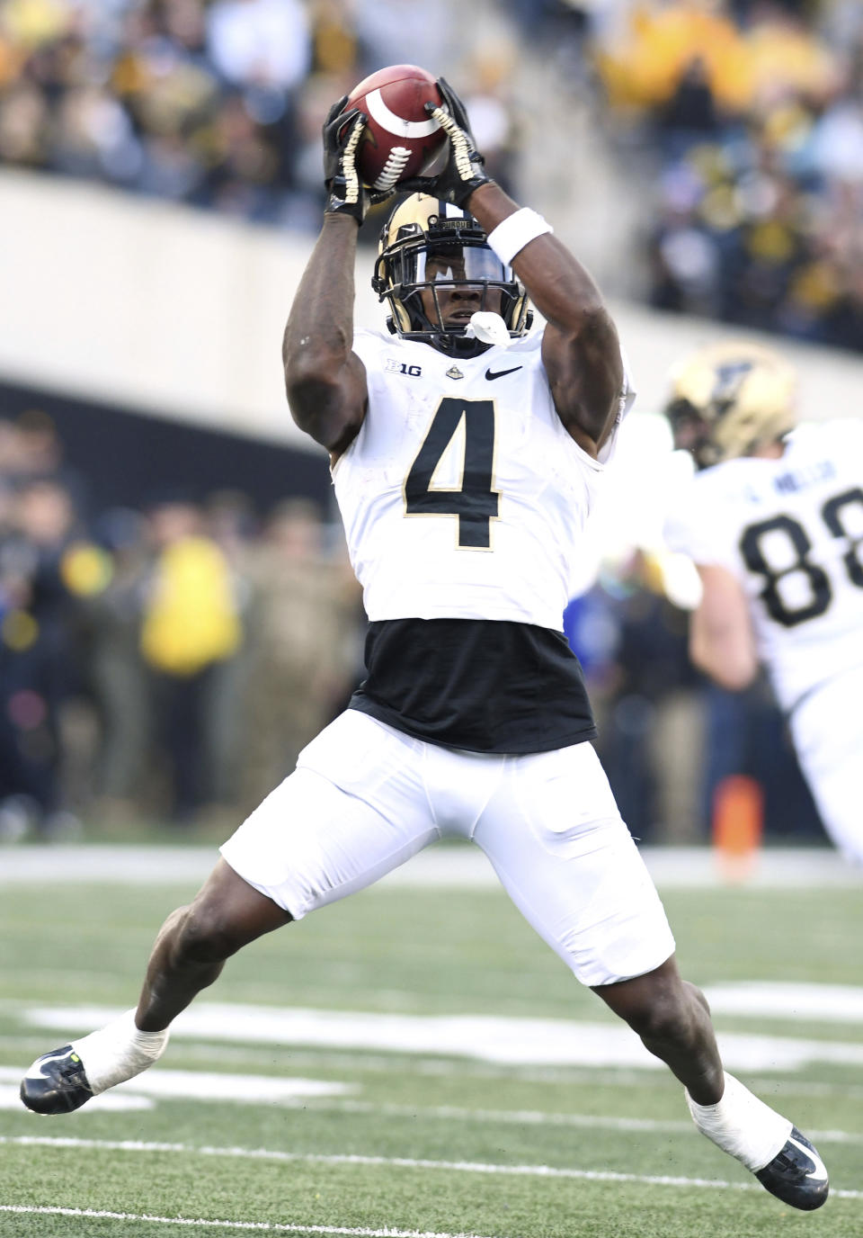 Purdue wide receiver Deion Burks (4) pulls in a pass during the second half of an NCAA college football game against Iowa, Saturday, Oct. 7, 2023, in Iowa City, Iowa. (AP Photo/Cliff Jette)