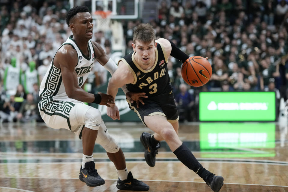 Purdue guard Braden Smith (3) drives as Michigan State guard Tyson Walker (2) defends during the first half of an NCAA college basketball game, Monday, Jan. 16, 2023, in East Lansing, Mich. (AP Photo/Carlos Osorio)
