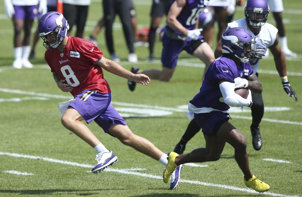 The Minnesota Vikings are hoping to ease some of the burden on quarterback Kirk Cousins, left, this season. (AP)