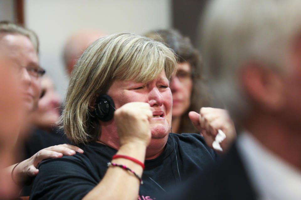 Dana Nelson, step mother of Ashley Young, reacts at the sentencing of Jared Chance in Kent County Circuit Court, Thursday, Oct. 10, 2019, in Grand Rapids, Mich. Chance, a Michigan man convicted of killing and dismembering a woman has been sentenced to at least 100 years in prison after a judge called his actions "reprehensible and heinous."(Brian Hayes/The Grand Rapids Press via AP)