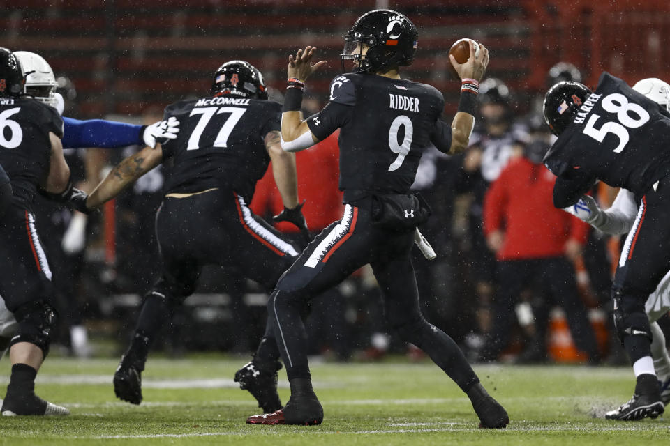 Cincinnati quarterback Desmond Ridder throws a pass during the first half of the American Athletic Conference championship NCAA college football game against Tulsa, Saturday, Dec. 19, 2020, in Cincinnati. (AP Photo/Aaron Doster)