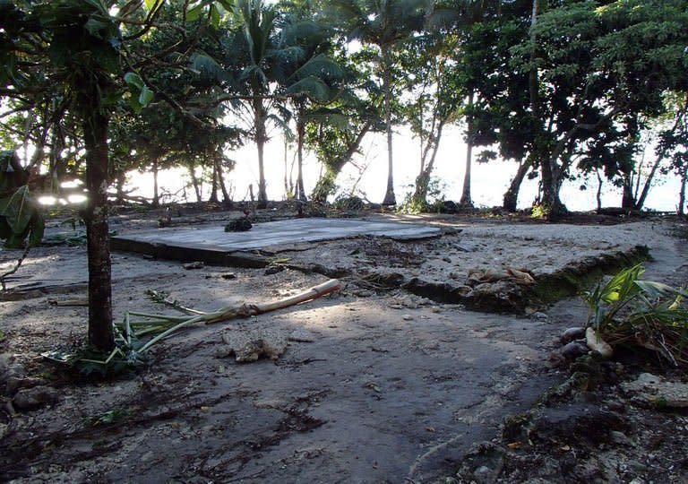 A home destroyed near Lata in the Santa Cruz Islands region of the Solomon Islands, seen on February 6, 2013, in this photo released by World Vision. Relief workers scrambled to reach quake-ravaged villages in the Solomons on Saturday, with "unusual seismic activity" sighted as strong aftershocks continued to jolt the remote Pacific region