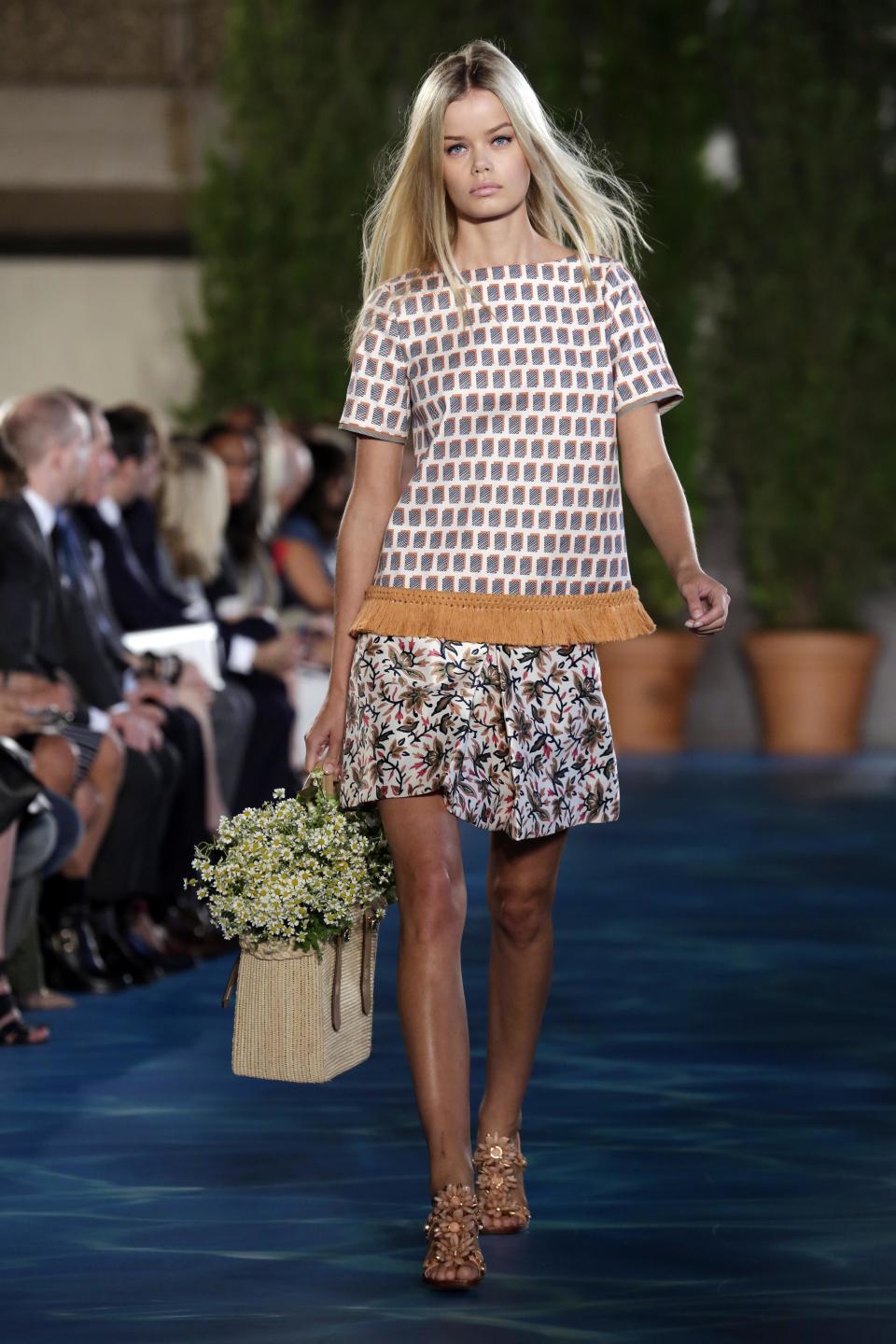 The Tory Burch Spring 2014 collection is modeled during Fashion Week in New York, Tuesday, Sept. 10, 2013. (AP Photo/Richard Drew)