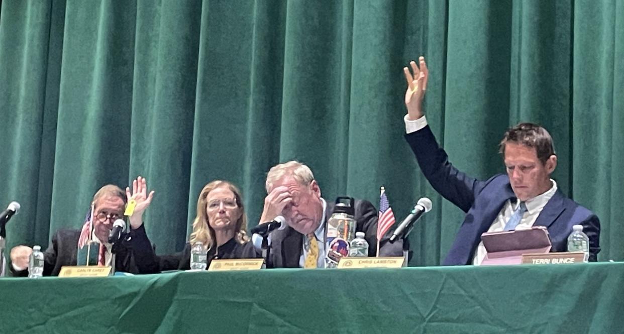 Dennis Select Board members vote against a recreational marijuana petition Tuesday night at the Dennis town meeting. From left, they are Jim Plath, Carlyn Carey, Paul McCormick and Chairman Chris Lambton. John Terrio was not present. A measure to allow recreational marijuana shops received 130 yes votes to 98 no's, but failed to generate the necessary two-thirds margin to be approved.