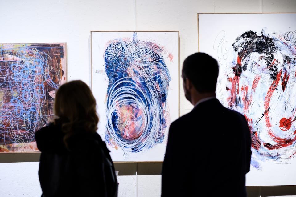 Viewers take in the work of Martin Pope at a January 2024 exhibit at Orr Street Studios.