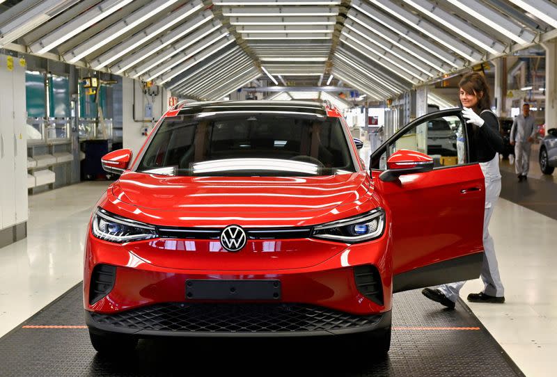 FILE PHOTO: A technician works on the final inspection of an electric Volkswagen ID. 4 car model, in Zwickau