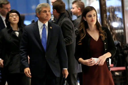 U.S. Representative Michael McCaul (R-TX) is escorted by Madeleine Westerhout (R) as he arrives at Trump Tower to meet with U.S. President-elect Donald Trump in New York, U.S., November 29, 2016. REUTERS/Mike Segar