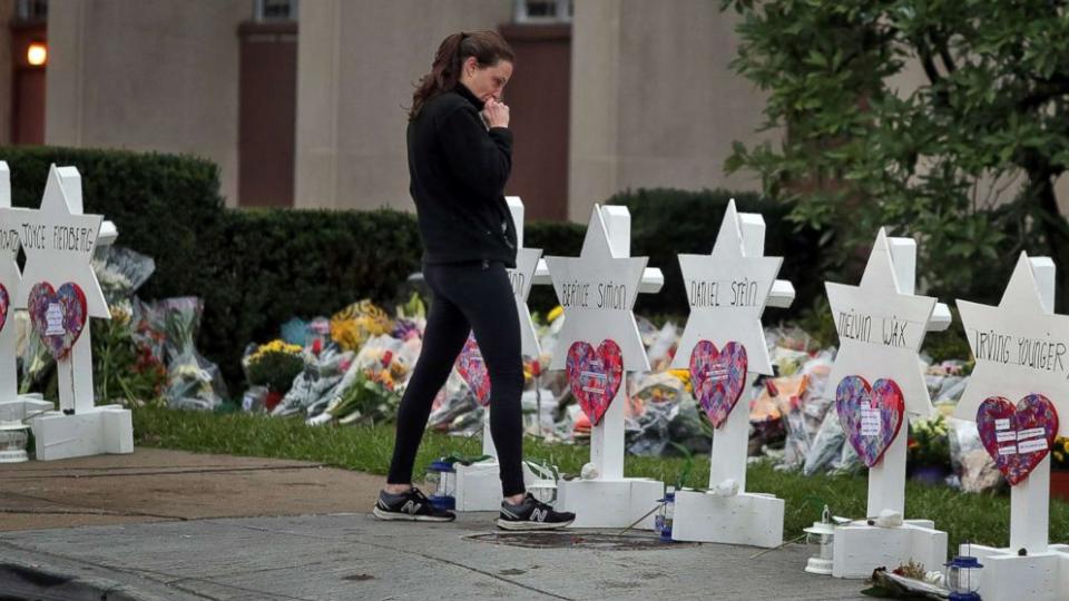 A woman pays her respects to the victims of the synagogue shooting. Image: AP