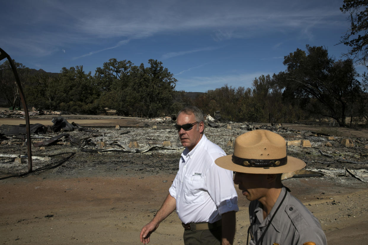 Secretary of the Interior Ryan Zinke, center, visits decimated Paramount Ranch in Agoura Hills, Calif., on Thursday. (Photo: Jae C. Hong/AP)