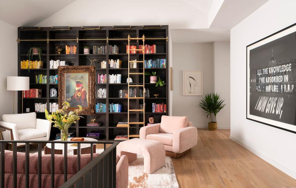 a room with a bookcase and a couch