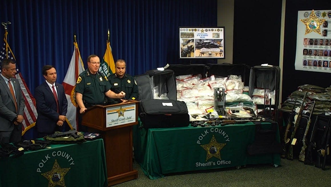 Polk County Sheriff Grady Judd talks about an international drug-smuggling operation based out of Winter Haven. With him are, from left, FDLE Special Agent Mark Bru Brutnell, State Attorney Brian Haas of the 10th Judicial Circuit and is Osceola County Sheriff Marcos Lopez.