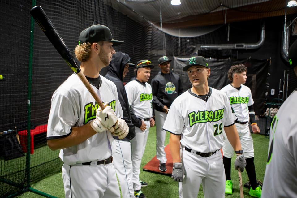 Players wait to hit during the Eugene Emeralds media day April 3 in Eugene.