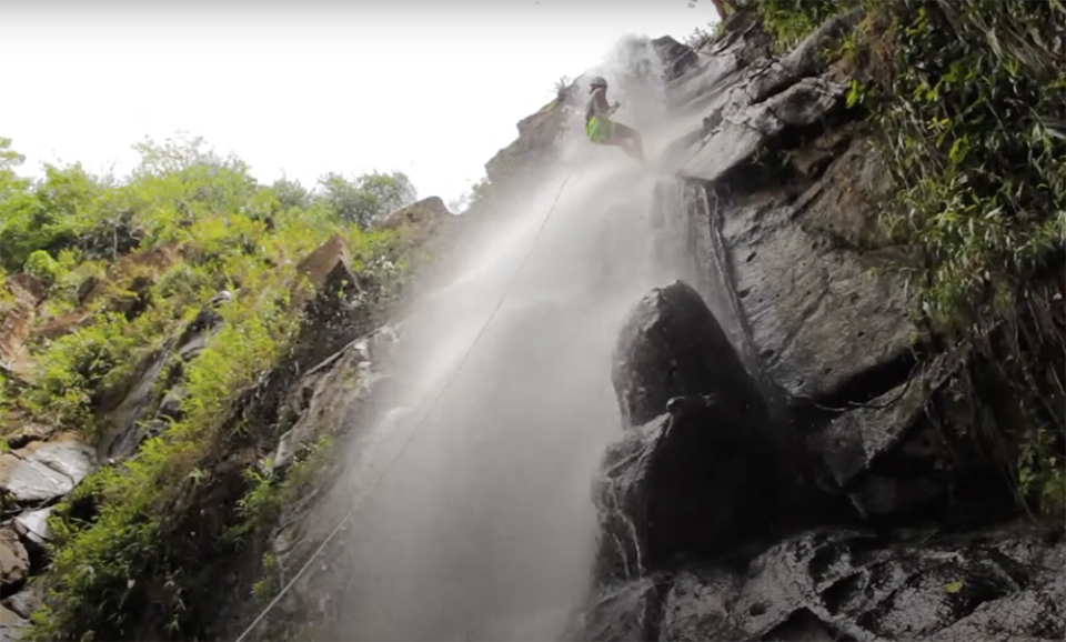 Waterfall rappelling in Belize