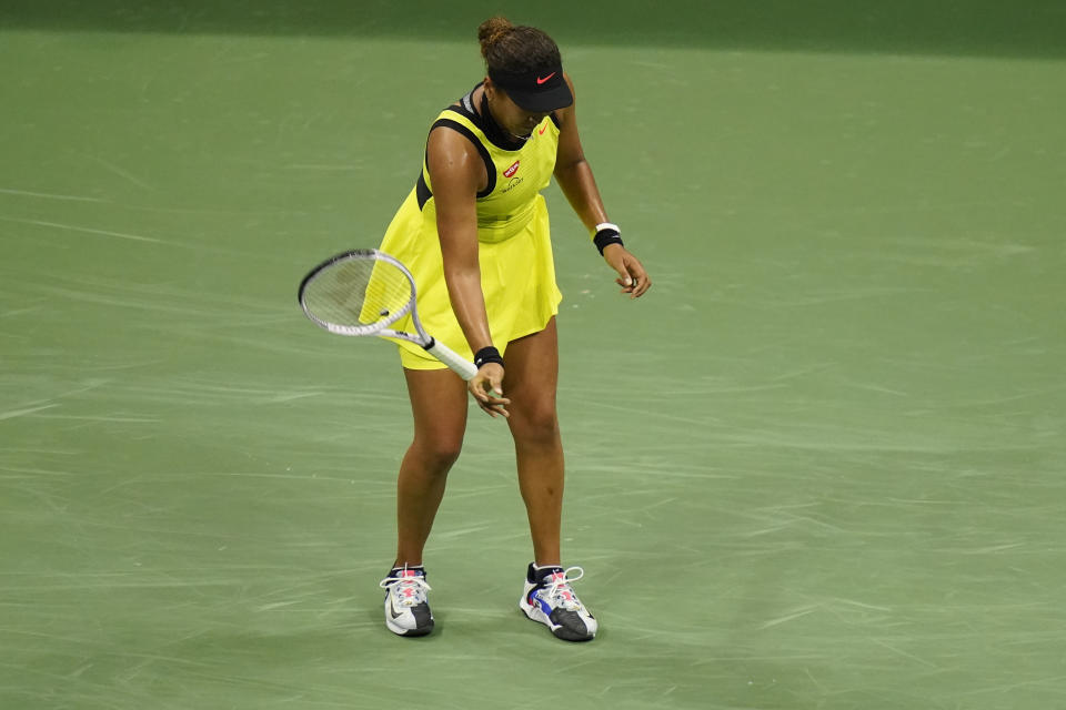 Naomi Osaka, of Japan, throws her racket down during a match against Leylah Fernandez, of Canada, at the third round of the US Open tennis championships, Friday, Sept. 3, 2021, in New York. (AP Photo/Frank Franklin II)