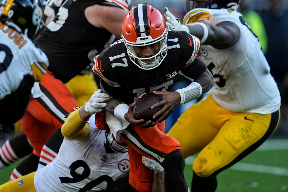 Pittsburgh Steelers linebacker T.J. Watt (90) hits Cleveland Browns quarterback Dorian Thompson-Robinson (17) during the second half of an NFL football game, Sunday, Nov. 19, 2023, in Cleveland. (AP Photo/Sue Ogrocki)