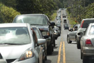 <p>In this Sunday, May 6, 2018, photo, traffic is seen along Highway 132 as Leilani Estates residents wait to return to their homes to gather vital belongings and animals in Pahoa, Hawaii. (Photo: Jamm Aquino/Honolulu Star-Advertiser via AP) </p>