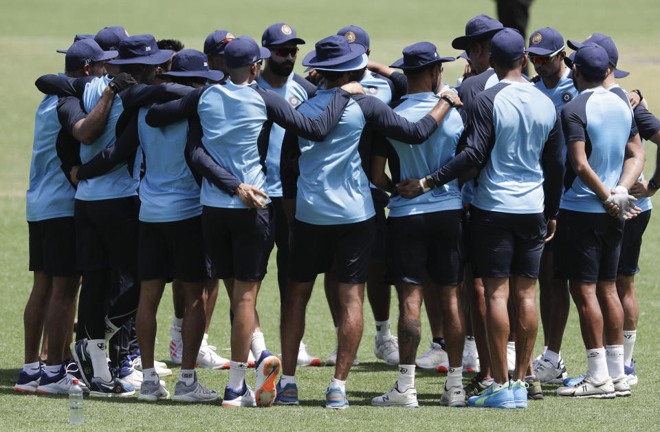 Indian players embrace ahead of the one day international cricket match between India and Australia at the Sydney Cricket Ground in Sydney, Australia, Sunday, Nov. 29, 2020. (AP Photo/Rick Rycroft)