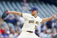 Milwaukee Brewers starting pitcher Eric Lauer throws to the Pittsburgh Pirates during the first inning of a baseball game Monday, Aug. 2, 2021, in Milwaukee. (AP Photo/Jeffrey Phelps)