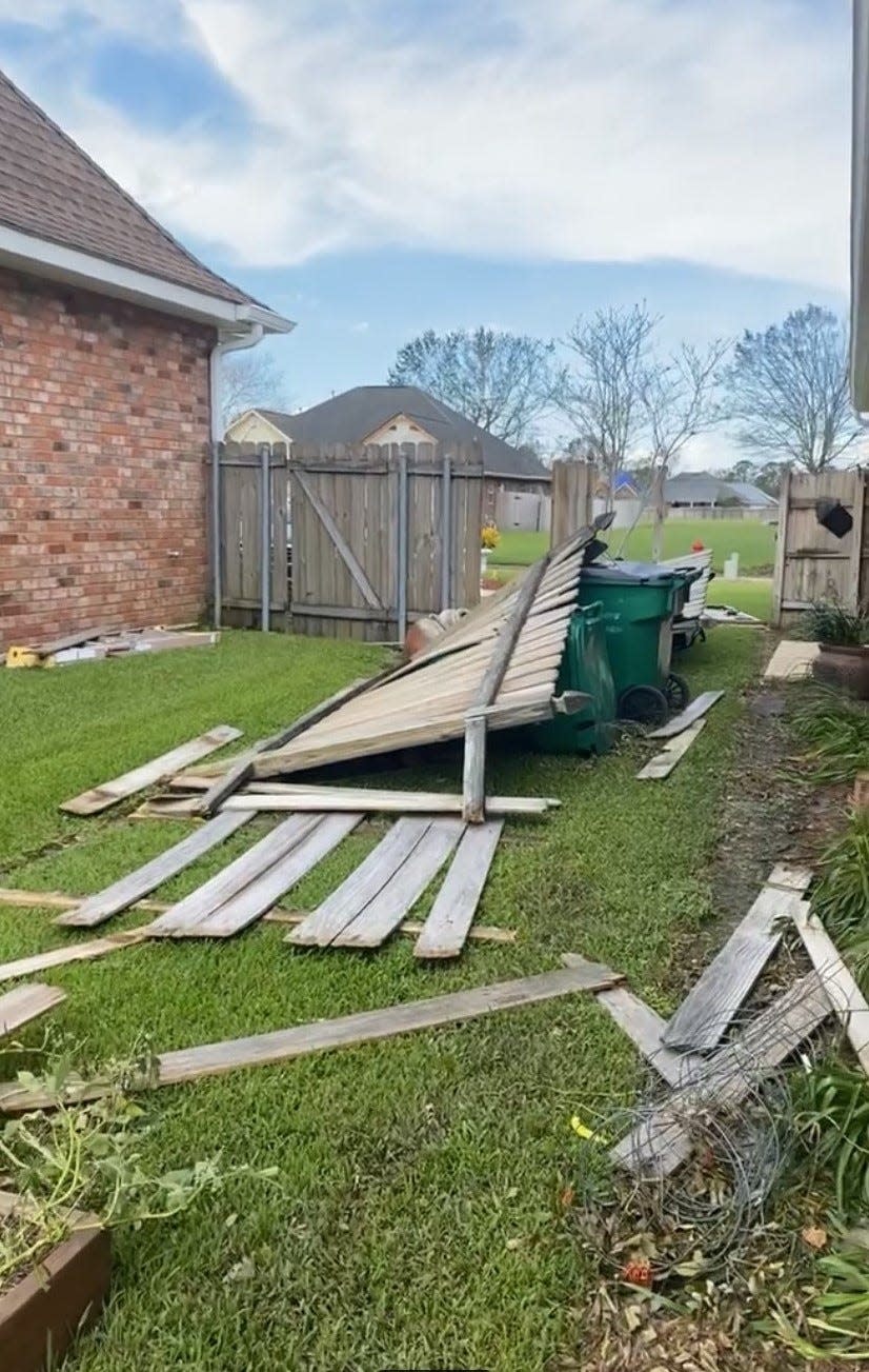 Addie Schmit said this downed fence is part of the hurricane damage in LaPlace.