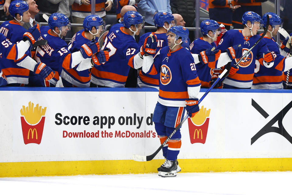 New York Islanders center Kyle Palmieri (21) is congratulated after scoring against the Tampa Bay Lightning during the first period of an NHL hockey game, Thursday, Feb. 8, 2024, in New York. (AP Photo/Noah K. Murray)