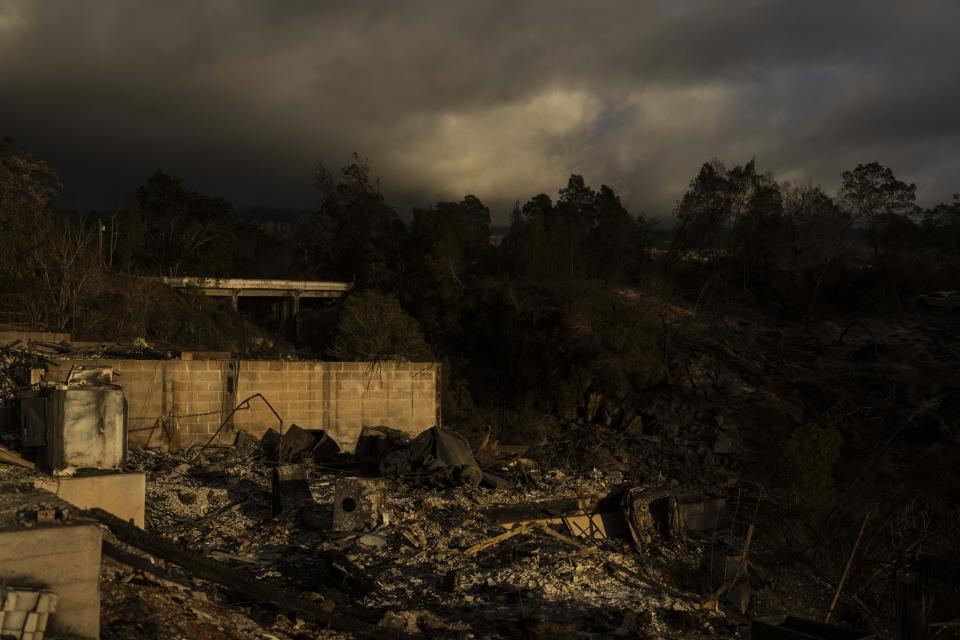 A home is consumed in a wildfire in Kula, Hawaii, Tuesday, Aug. 15, 2023. Wildfires have devastated parts of the Hawaiian island of Maui. (AP Photo/Jae C. Hong)
