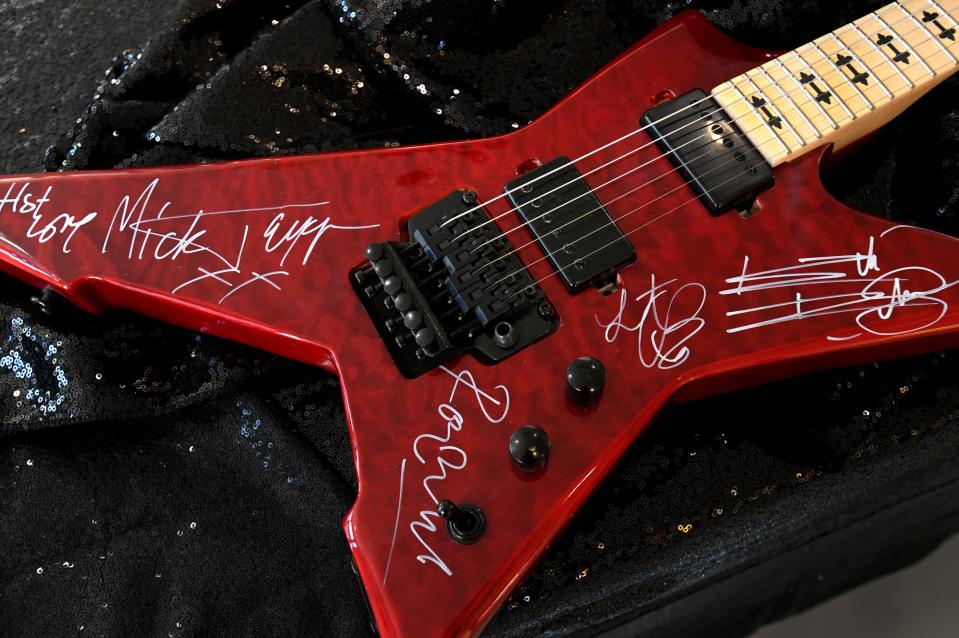 An autographed Rolling Stones guitar is an auction item for Christmas in the Sky. 