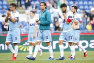 Lazio's Antonio Candreva (2nd R) leaves the pitch with his team mates at the end of their Serie A soccer match against AS Roma at the Olympic stadium in Rome, Italy, May 25, 2015. REUTERS/Tony Gentile