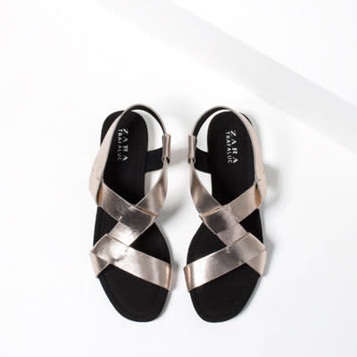 Get your fix of precious metals with these cross over sandals from Zara for just £19.99.