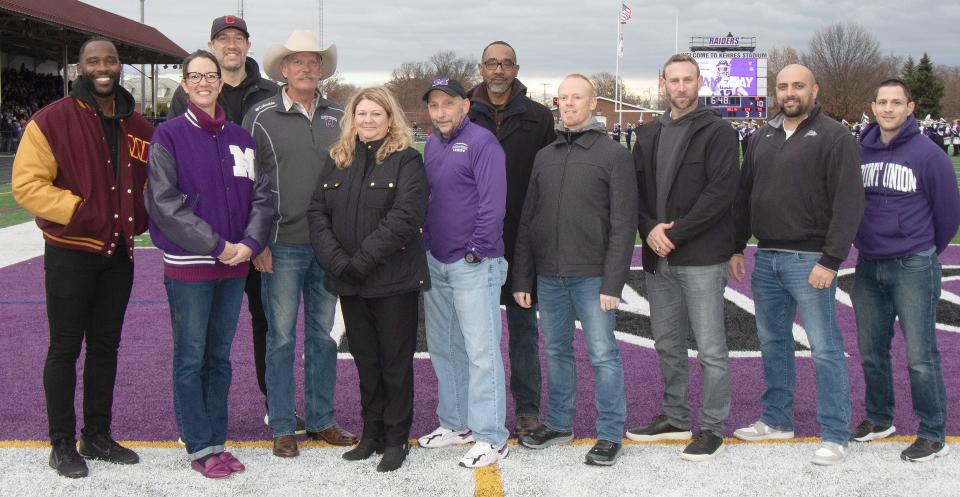 The University of Mount Union's M Club Hall of Fame Class of 2023 was introduced at halftime of the Purple Raiders' game against Baldwin Wallace at Kehres Stadium. Class members present Saturday, Nov. 11, 2023, for the ceremony were, from left, Pierre Garcon, Natalie Lambert Williams, Kyle Kapinski, Jeffrey Powles, Tammy Dougherty Durham, Dean Marini, Willie Dawson, Nic Saluppo, Christopher Kern, Eric Belancic and John Biacofsky.