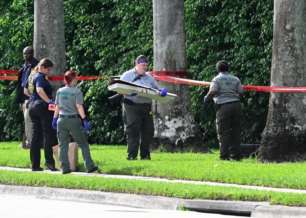 An evidence box which may contain the rifle used during the shooting near Trump International Golf Club while Trump was playing golf. MEGA