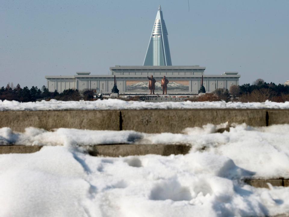 Statues of Kim Il Sung, left, and Kim Jong Il at Mansu Hill near the Ryugyong Hotel in Pyongyang.