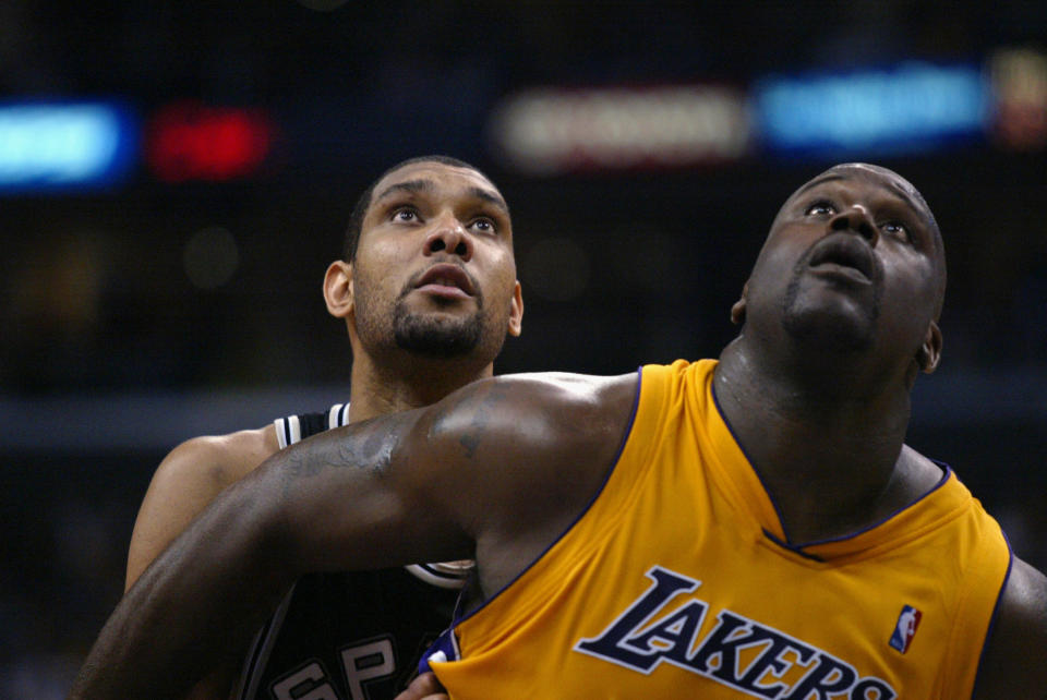 Shaquille O'Neal boxes out Tim Duncan of the San Antonio Spurs in Game four of the Western Conference Semifinals during the 2004 NBA Playoffs at Staples Center on May 11, 2004 in Los Angeles, California. (Photo by Lisa Blumenfeld/Getty Images)