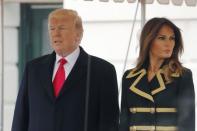 U.S. President Donald Trump and first lady Melania Trump wait to welcome Australian Prime Minister Malcolm Turnbull and Lucy Turnbull to the White House in Washington, U.S., February 23, 2018. REUTERS/Jonathan Ernst