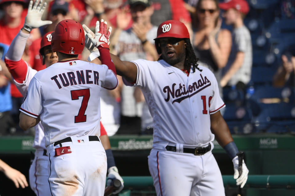 Washington Nationals' Trea Turner (7) celebrates his home run with Josh Bell, right, during the fourth inning of the team's baseball game against the Tampa Bay Rays, Wednesday, June 30, 2021, in Washington. (AP Photo/Nick Wass)