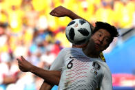 <p>Taking one for the team: South Korea’s Park Joo-ho competes for a header. (REUTERS/Ivan Alvarado) </p>