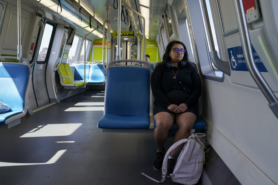 Sadaf Zahoor sits in a Bay Area Rapid Transit train Wednesday, June 7, 2023, in Oakland, Calif. Zahoor has used public transit her whole life and relies on it to get to work. (AP Photo/Godofredo A. Vásquez)