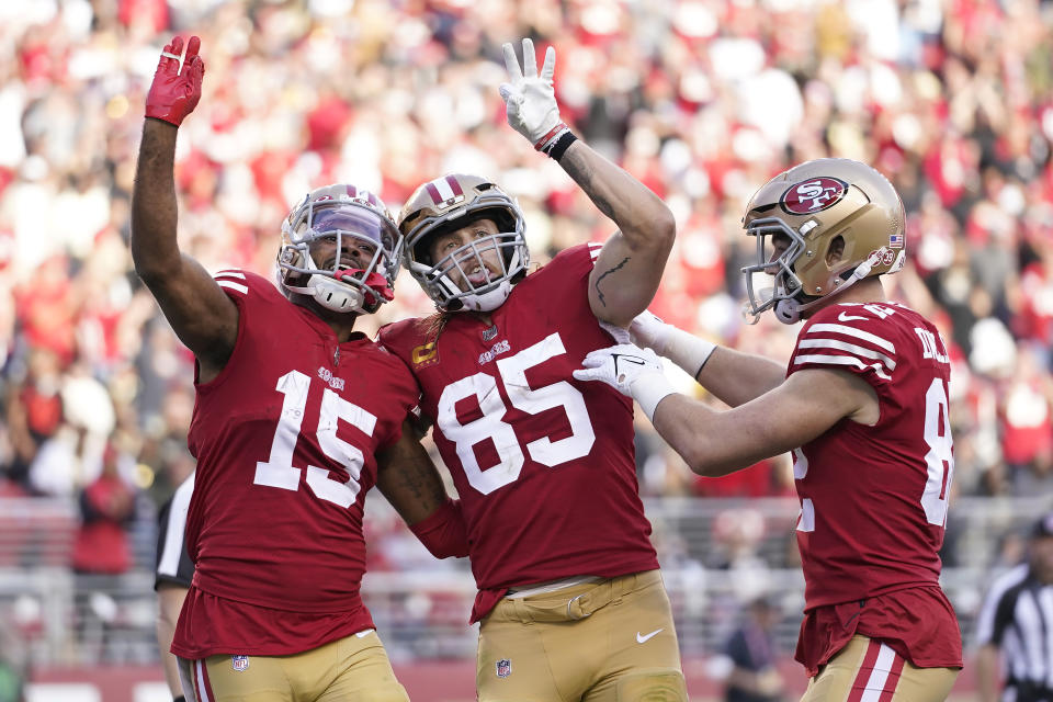 San Francisco 49ers wide receiver Jauan Jennings (15) celebrates after catching a touchdown pass with tight end George Kittle (85) and tight end Ross Dwelley during the first half of an NFL football game against the New Orleans Saints in Santa Clara, Calif., Sunday, Nov. 27, 2022. (AP Photo/Godofredo A. Vásquez)