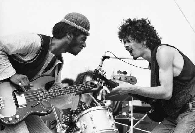 <p>Victor Englebert/Photo Researchers History/Getty</p> Carlos Santana (R) and David Brown (L)