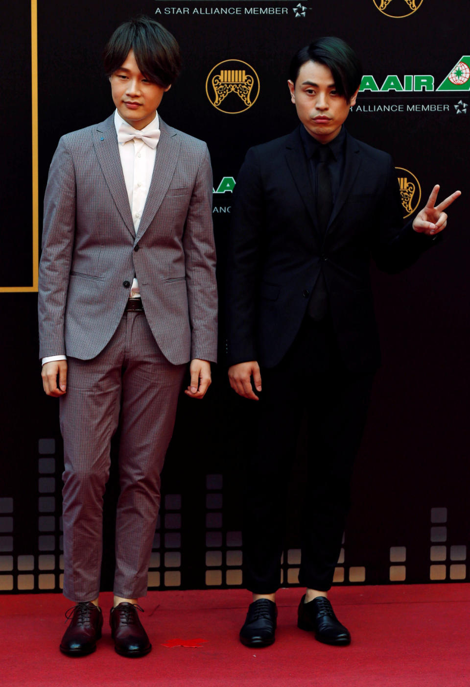 Members of Taiwanese band “io”, Hans Chen (L) and Angus Chan, pose on the red carpet at the 27th Golden Melody Awards in Taipei, Taiwan June 25, 2016. (Reuters/Tyrone Siu)