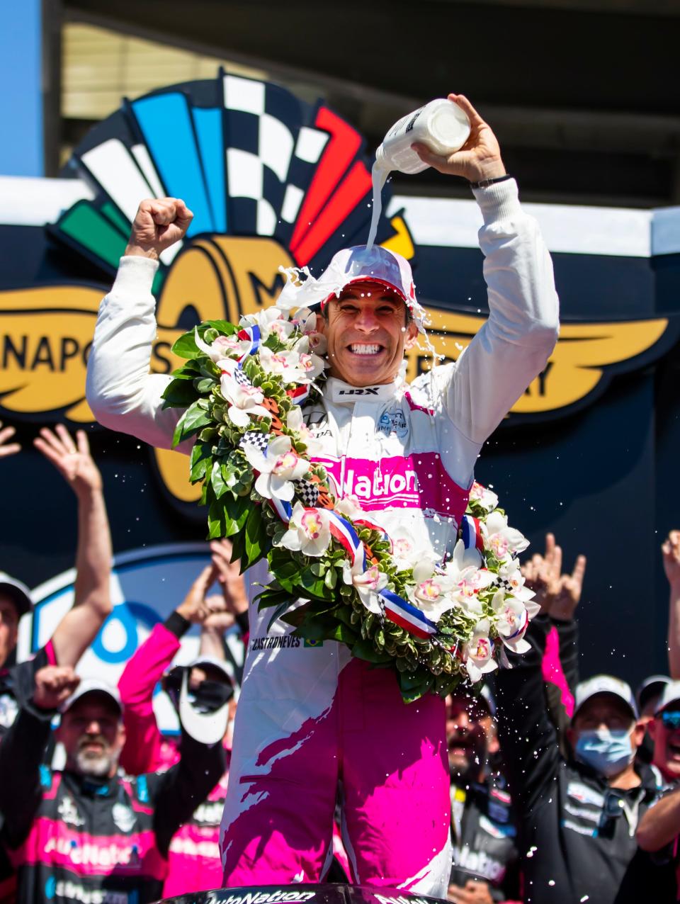 Helio Castroneves celebrates as he dumps milk on himself after winning the 105th Indianapolis 500.