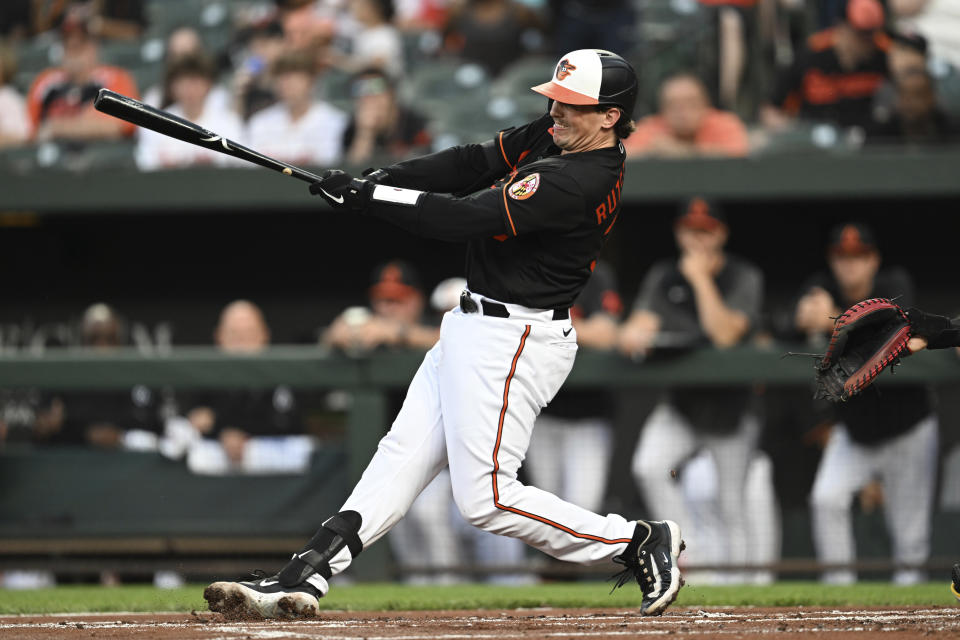 Baltimore Orioles' Adley Rutschman follows through on a single against the Pittsburgh Pirates in the first inning of a baseball game, Friday, May 12, 2023, in Baltimore. (AP Photo/Gail Burton)