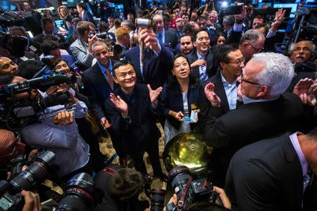 Alibaba Group Holding Ltd. founder Jack Ma celebrates after ringing a ceremonial bell at the New York Stock Exchange to celebrate the company's initial public offering (IPO) under the ticker "BABA" in New York September 19, 2014. REUTERS/Brendan McDermid