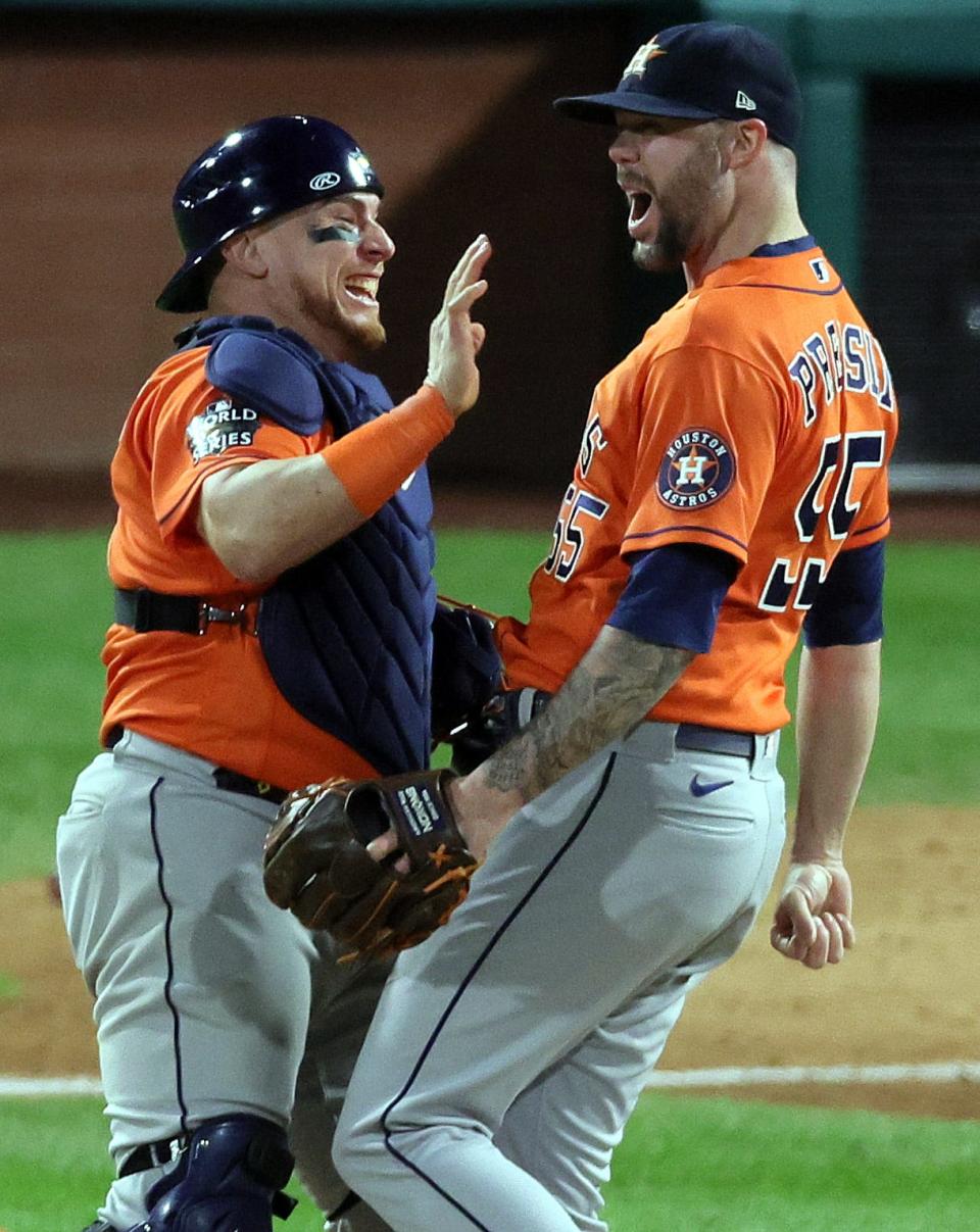 Astros' Christian Vazquez and Ryan Pressly celebrate a combined no-hitter to defeat the Phillies 5-0.