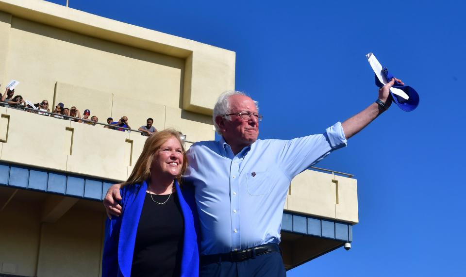 Bernie Sanders and his wife, Jane acknowledge the crowd of supporters during a campaign rally