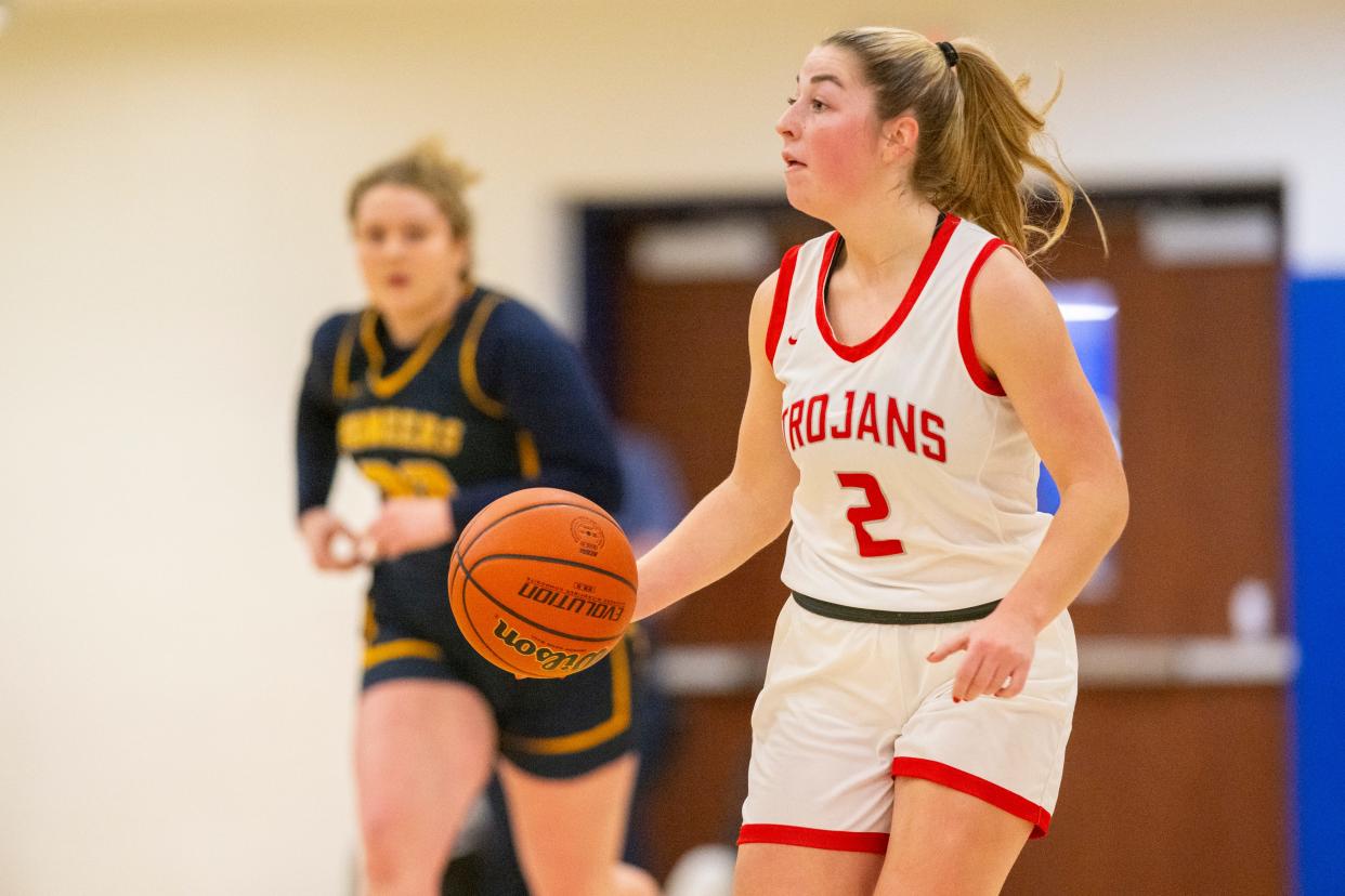 Center Grove High School senior Audrey Annee (2) brings the ball up court during the first half of an IHSAA Class 4A Sectional championship basketball game against Mooresville High School, Saturday, Feb. 3, 2024, at Mooresville High School.