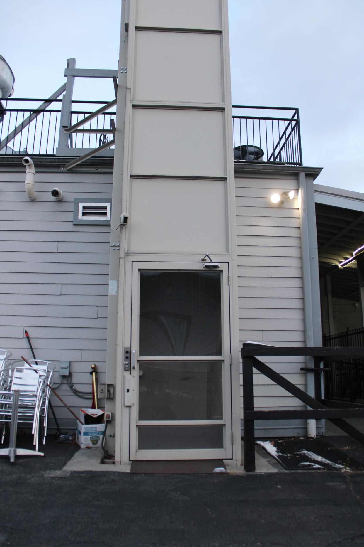 Jewel Currie's enclosed outdoor wheelchair lift.