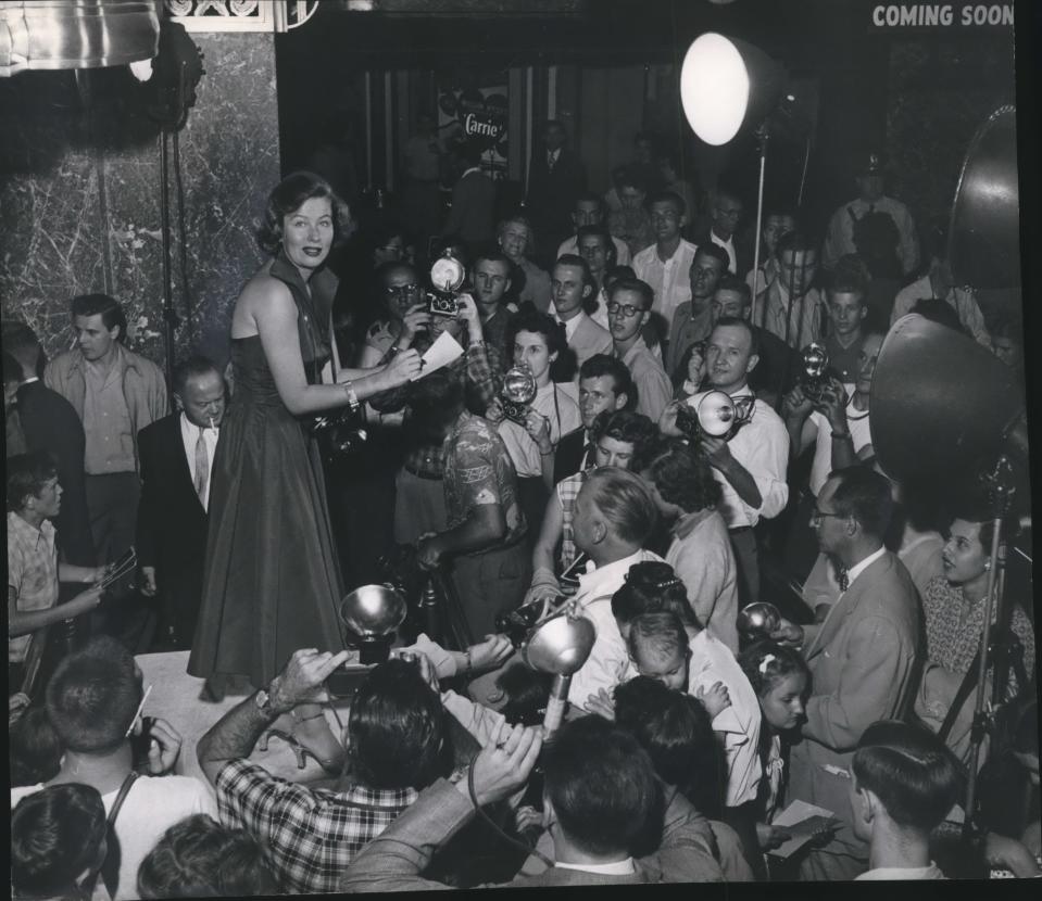 Actress and Milwaukee native Nancy Olson is surrounded by camera-toting fans at Milwaukee's Warner Theatre on Sept. 11, 1952. She was in town making a personal appearance for her latest movie, "Big Jim McLain" with John Wayne.